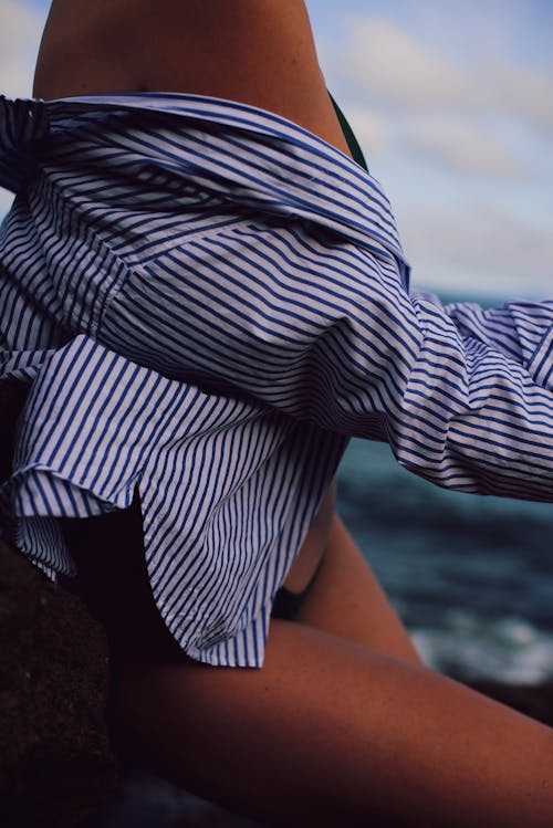 Person in Blue and White Stripes Shirt