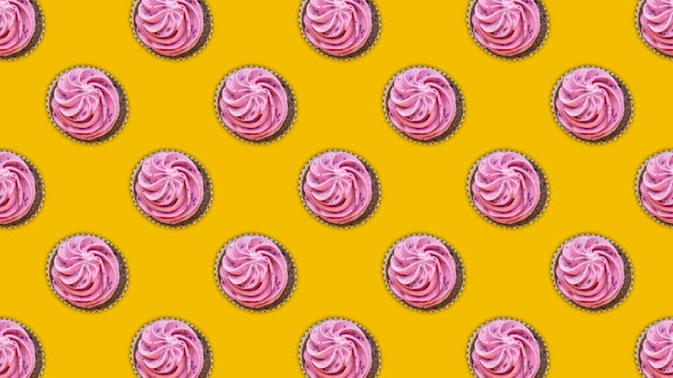 Pink Cupcakes On Yellow Studio Background