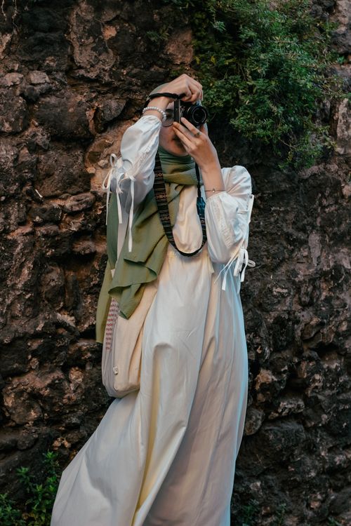 Free Woman in hijab photographing outdoors in Istanbul, Türkiye. Stock Photo