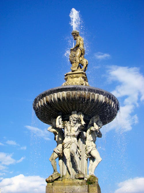 Bronze Fountain Sculpture on Blue Sky