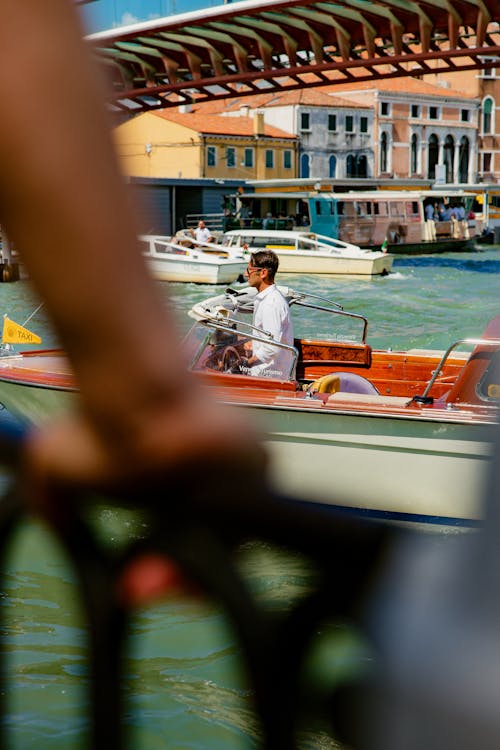 Man sailing a boat in Venice