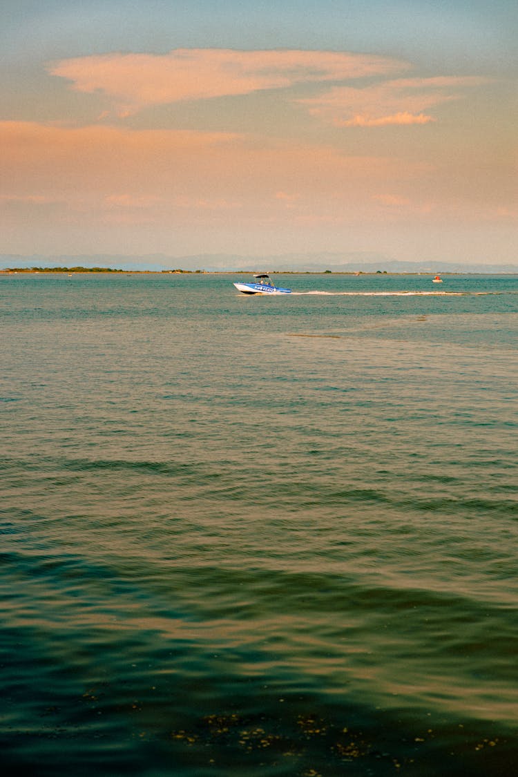 White Boat Sailing On Sea