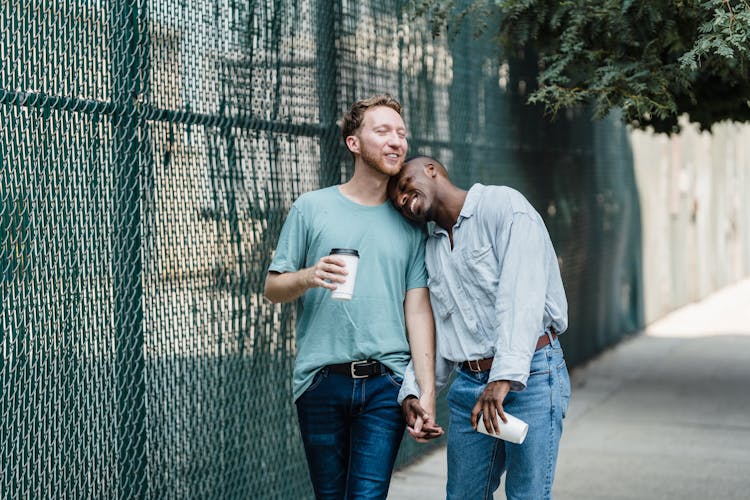 Happy Gay Couple On A Walk In City 