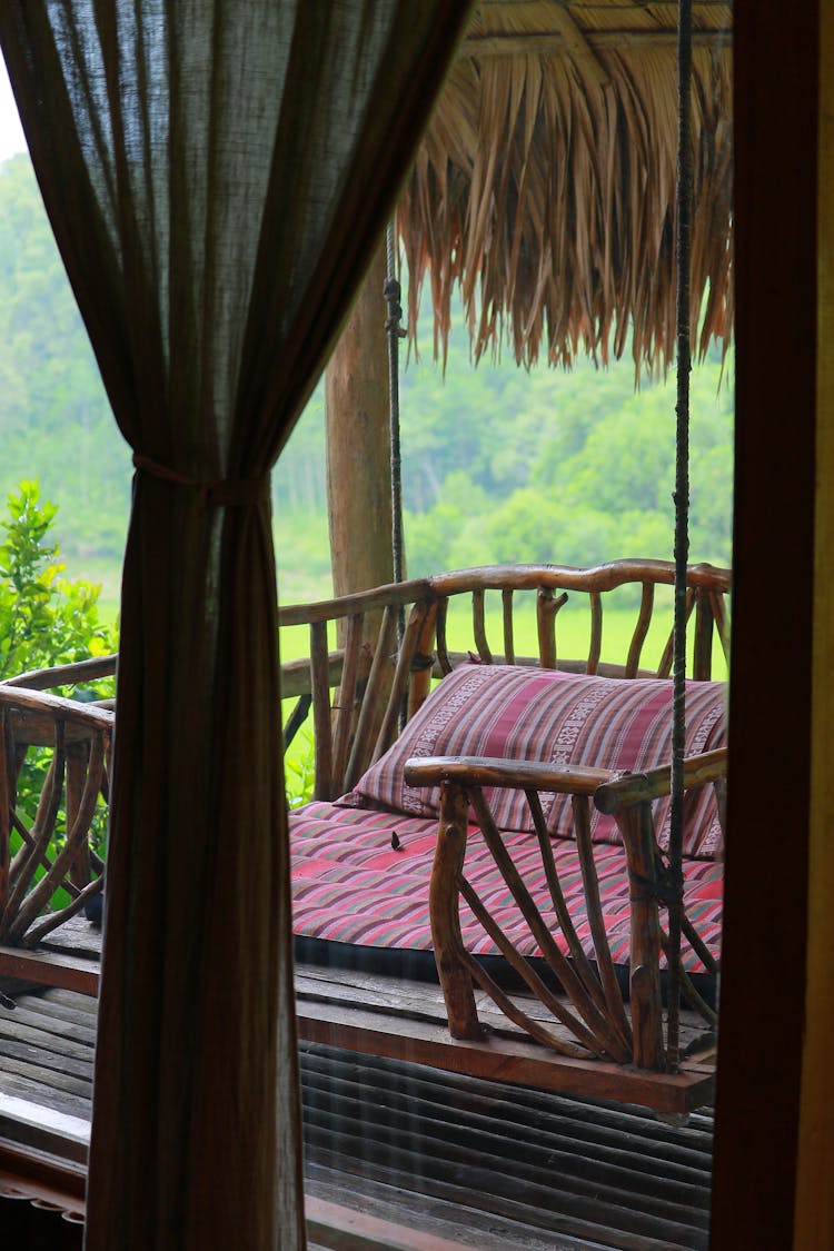 Bed On A Treehouse Balcony