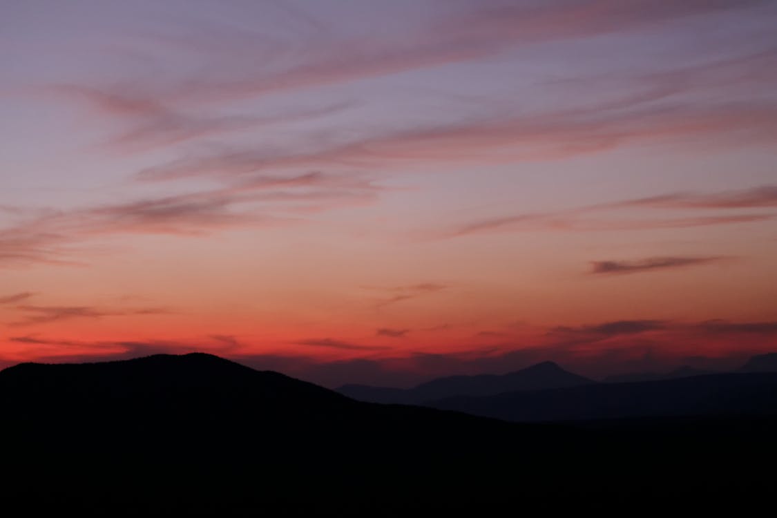 Fotos de stock gratuitas de cielo impresionante, cielo naranja, montañas