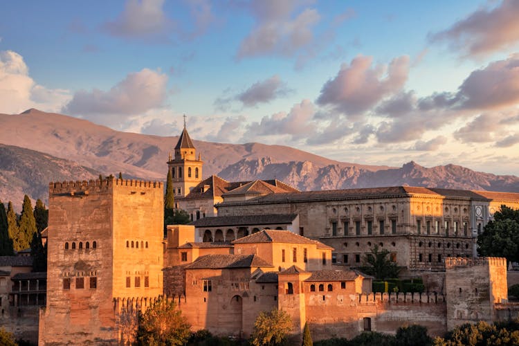 Old City Fortification In Mountains Landscape On Sunset