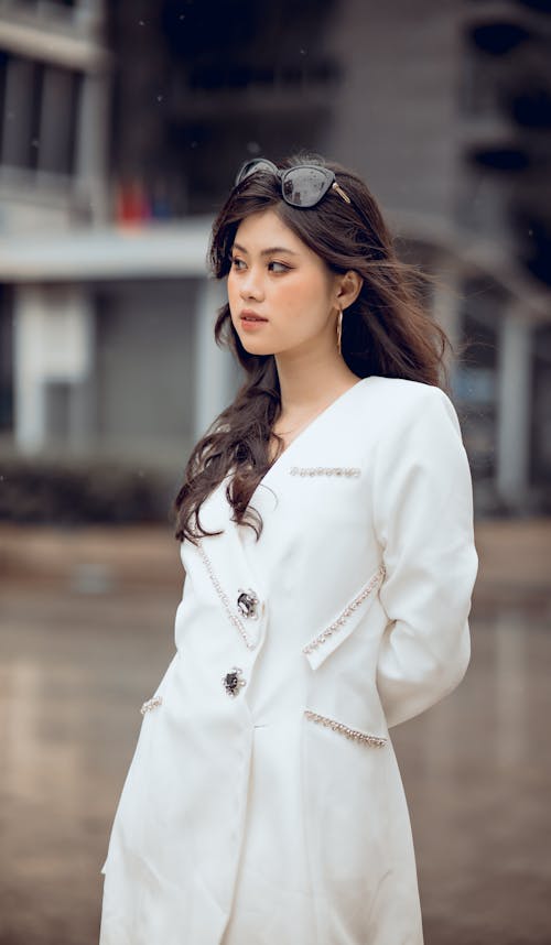 Beautiful Woman in White Dress Posing