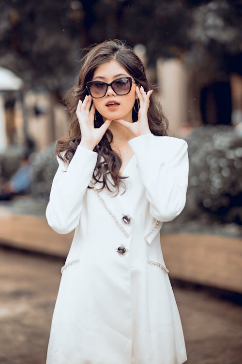 Beautiful Woman in White Dress Wearing Sunglasses