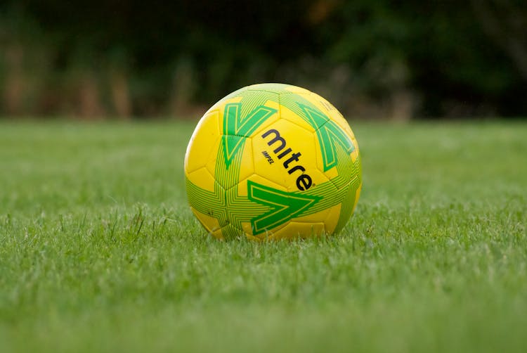 Yellow Soccer Ball On The Grass