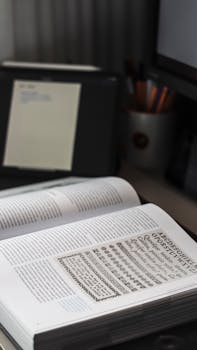 An open book displaying typography on a desk, ideal for designers or educators.