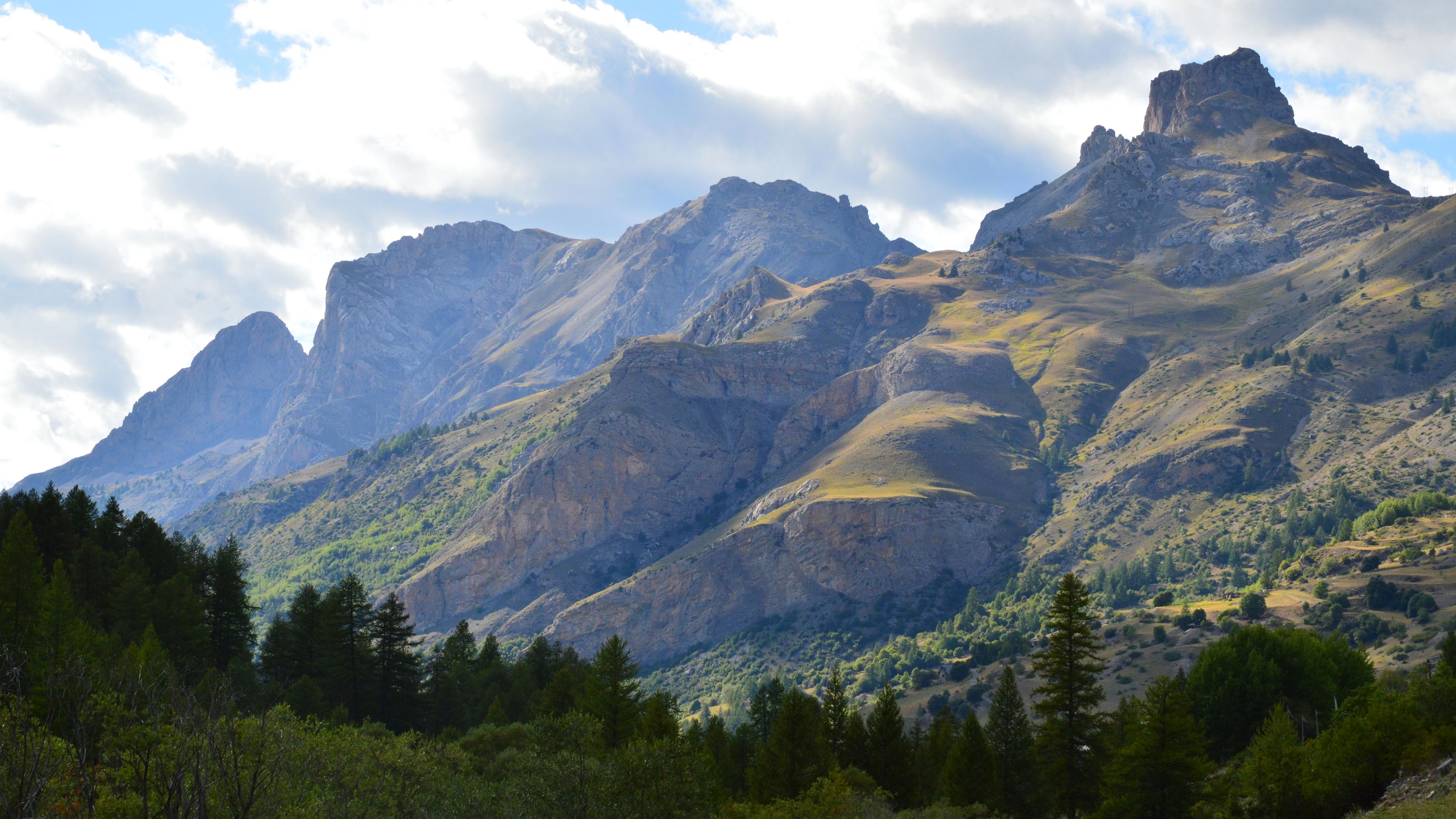 Green Mountains Under a Blue Sky and White Clouds · Free Stock Photo