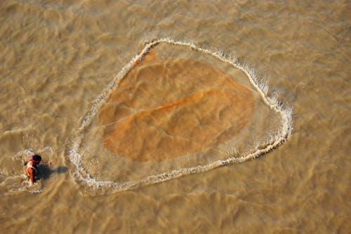 High Angle Shot of a Man Going Fishing 