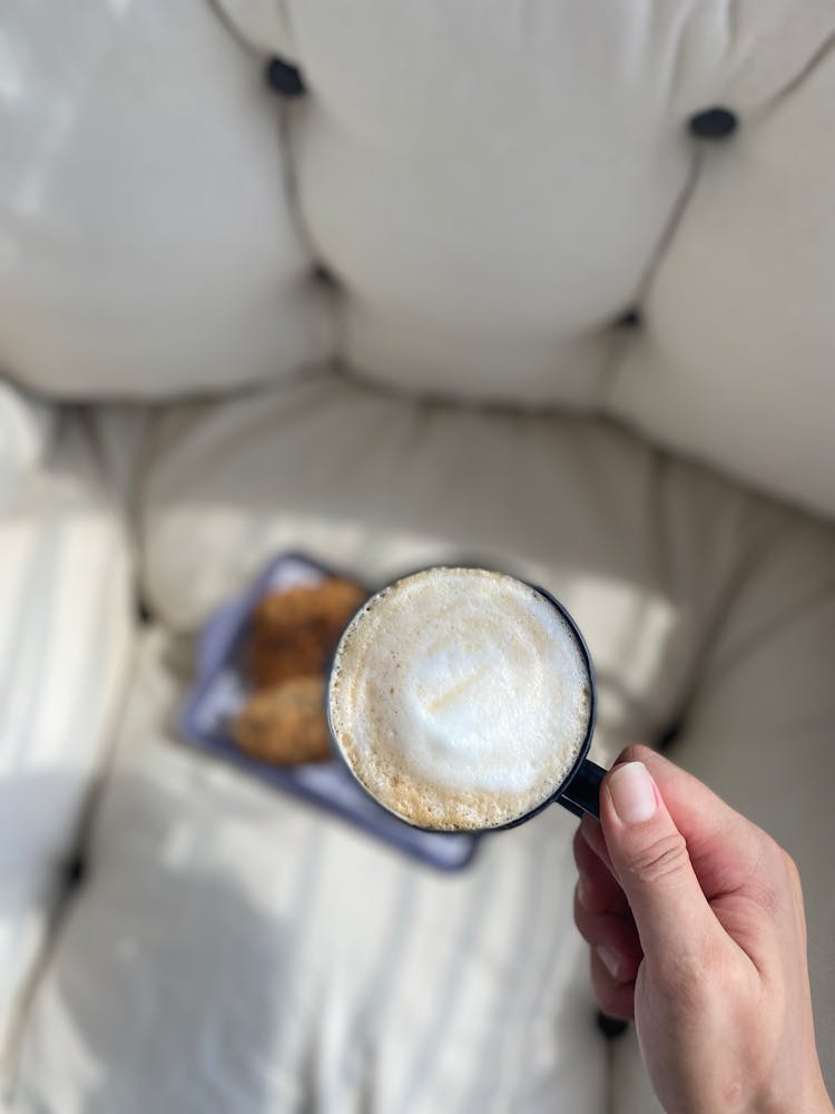 Hand Holding A Cup Of Coffee