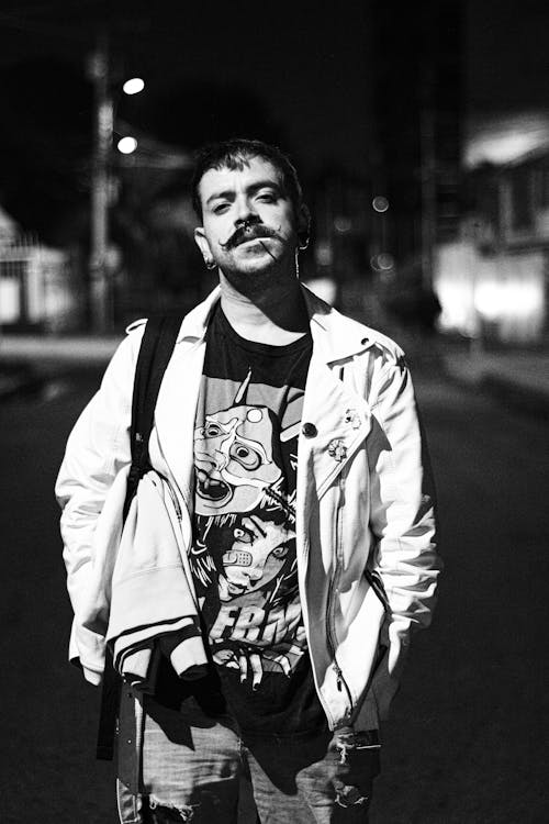 Grayscale Photo of a Man with Mustache Wearing a Jacket