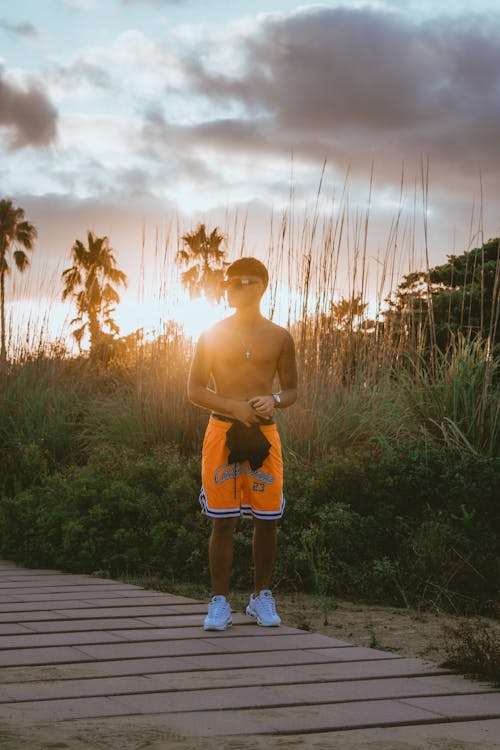 A Shirtless Man Wearing Sunglasses