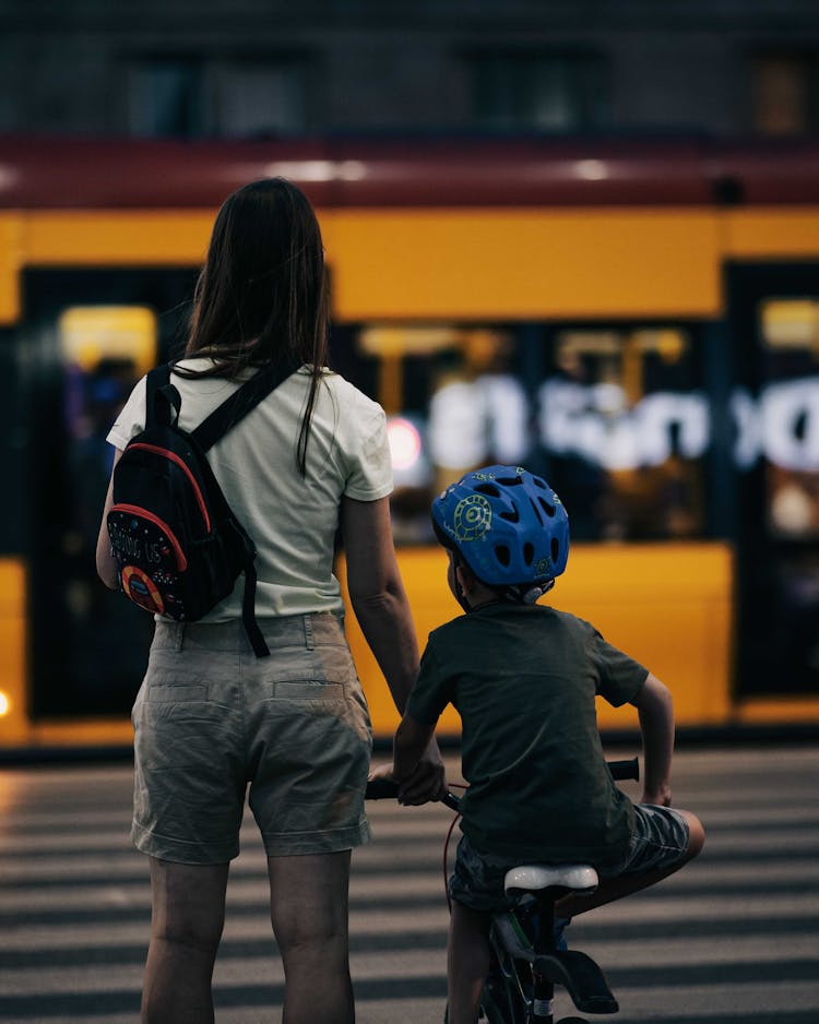 Woman With Child On City Street