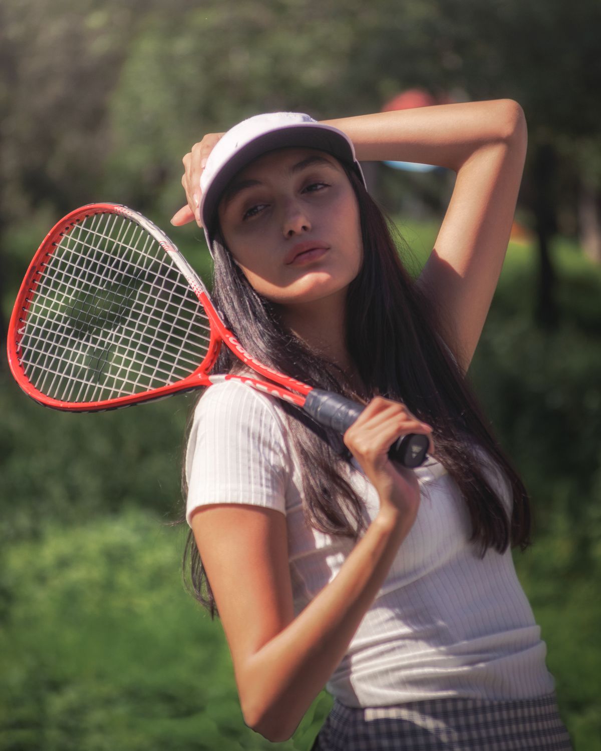 Photo Poses With Racket Woman Posing with a Tennis Racket · Free Stock Photo