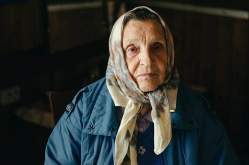 Photo of Elderly Woman Wearing Headscarf