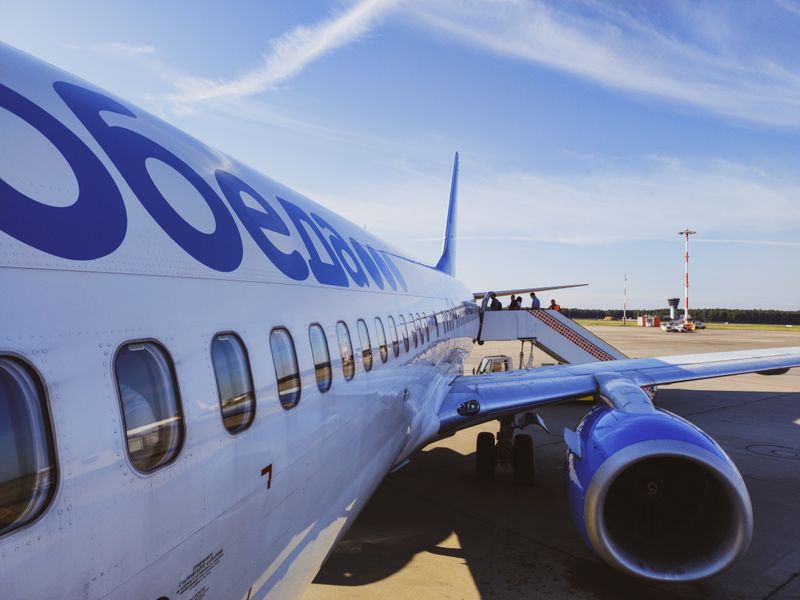 Commercial airplane boarding passengers at the airport