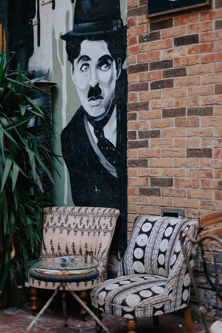 Patterned Armchairs In Front Of A Cafe In City 