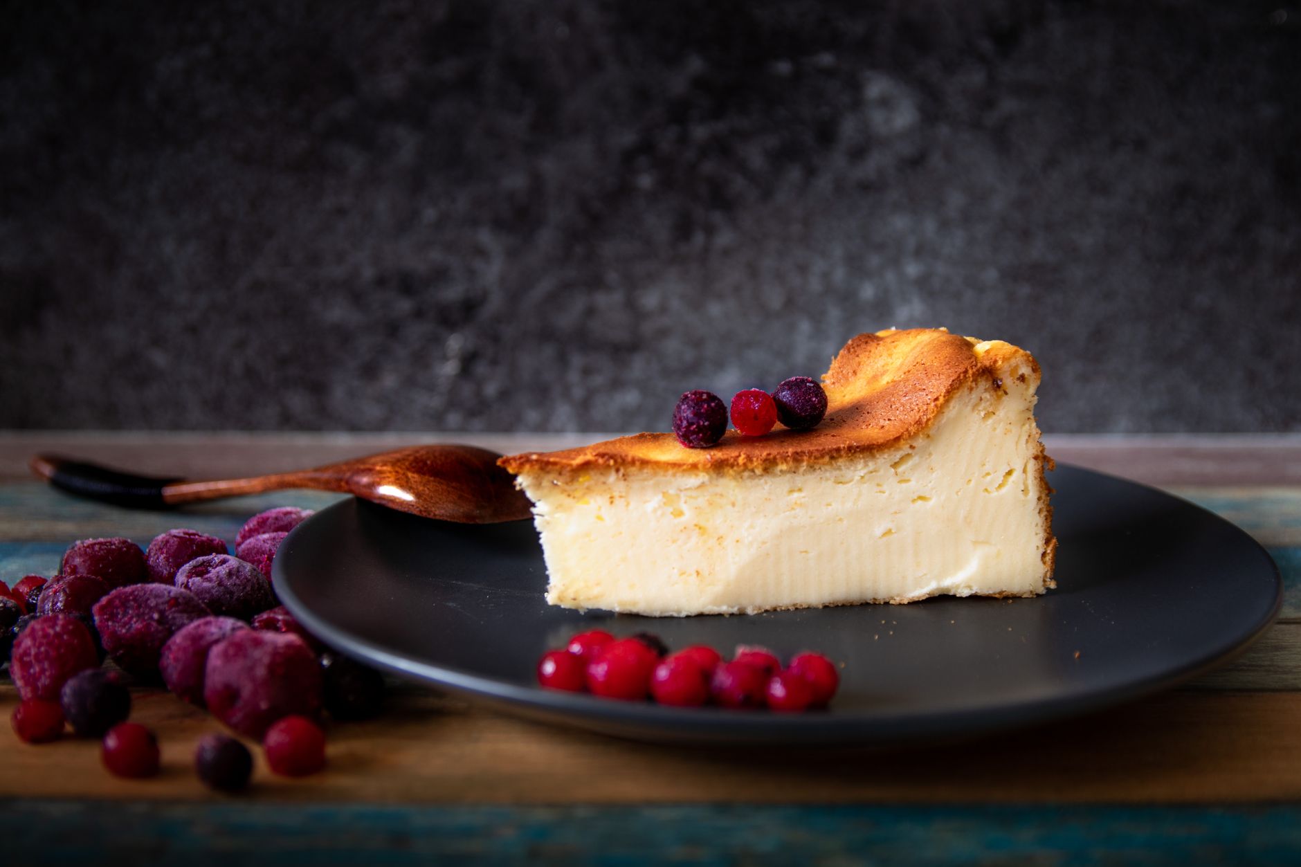 Rustic burnt Basque cheesecake fresh out of the oven with parchment paper