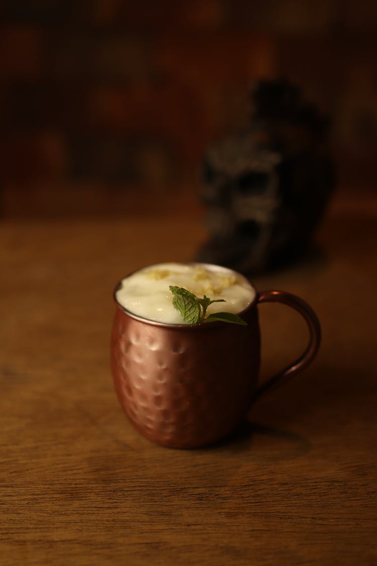 Foamy Drink In A Brass Cup