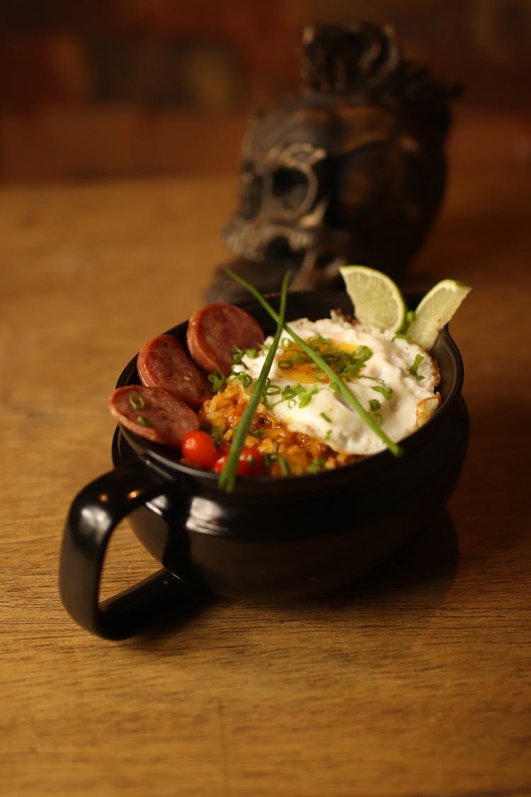 Cooked Food On Black Bowl With Handle