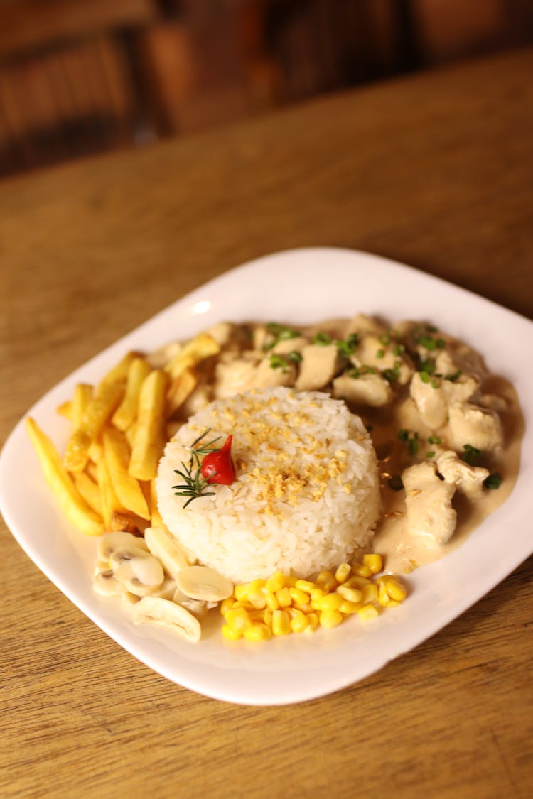 Rice And Chicken Dinner On A Plate