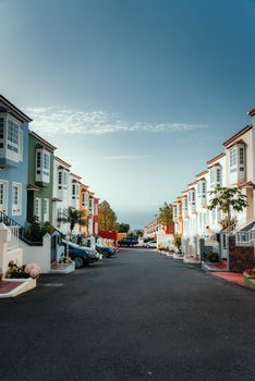 Vibrant townhouses line a serene street in La Orotava, CN, Spain.