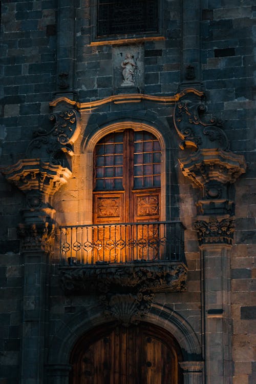 Illuminated Balcony Door of a Gothic Building