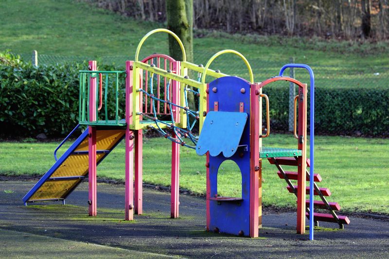 Colorful commercial playground equipment in a park