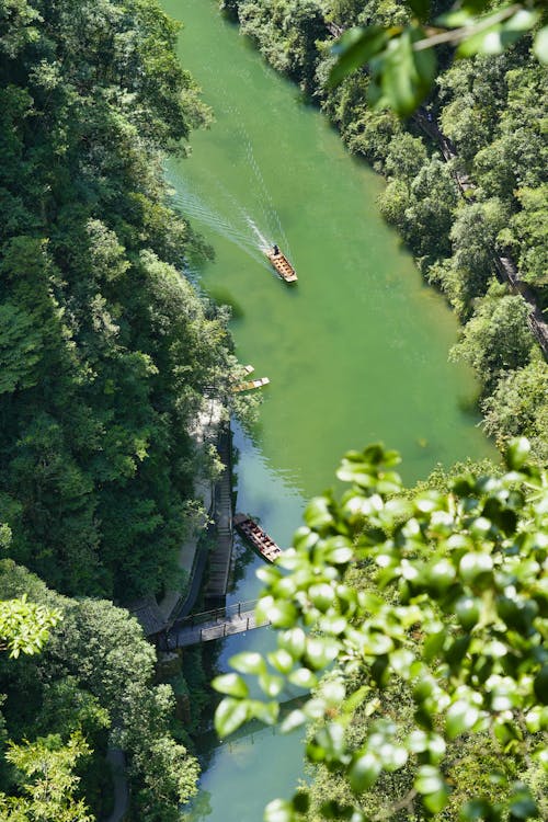 Aerial View of Boats Cruising in the River