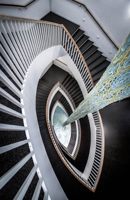 Contemporary spiral staircase with unique design inside a Chicago building.