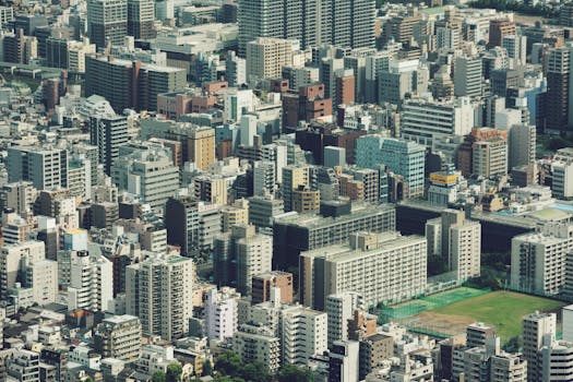 Explore a stunning aerial view of Tokyo's dense skyscrapers and urban landscape.