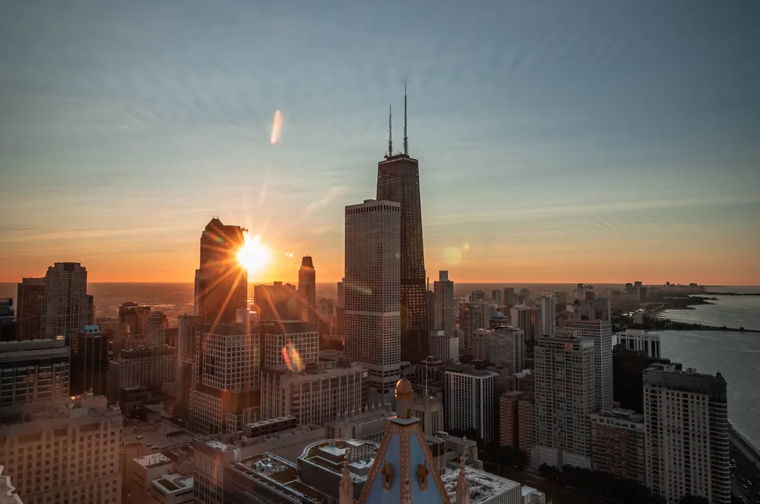 The 10 Best Places to Stay in Chicago (For Every Budget) 4 Chicago high-rise buildings glowing at golden hour, evoking the Wrigleyville skyline near Hotel Zachary