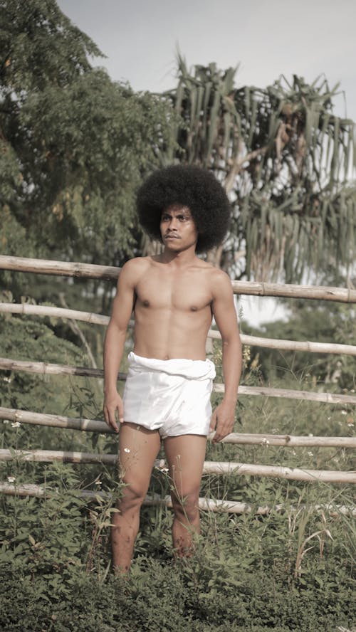 Shirtless Man with Afro hair