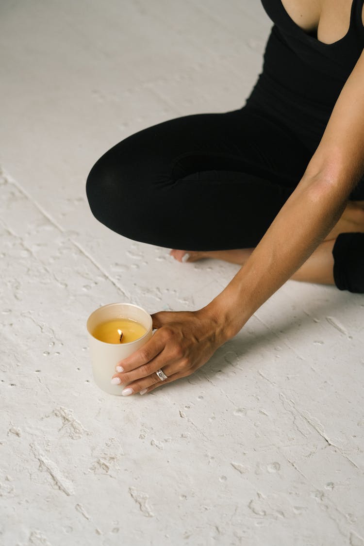 Woman Holding A Burning Candle 