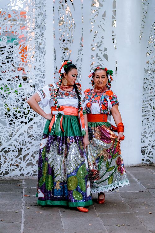 Free Two women in colorful traditional Mexican dresses, celebrating culture in Puebla. Stock Photo