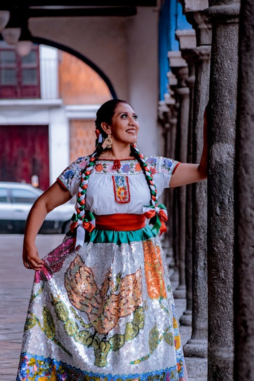Smiling Woman in a Folk Embroidered Dress with Sequins