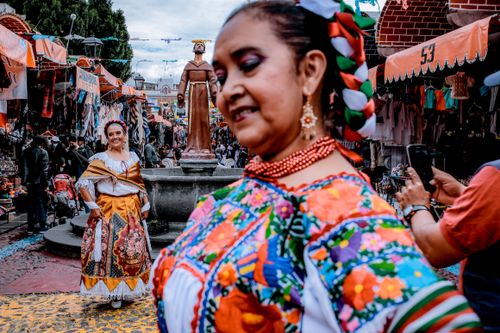 Free Vibrant celebration of Mexican culture in Puebla with traditional clothing and street festival. Stock Photo