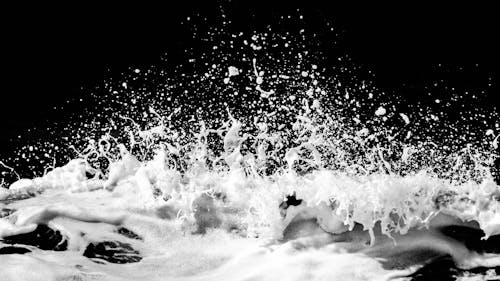 Grayscale Photo of Crashing Waves