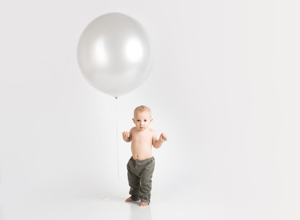 Free Baby Wearing Gray Pants Photo Stock Photo