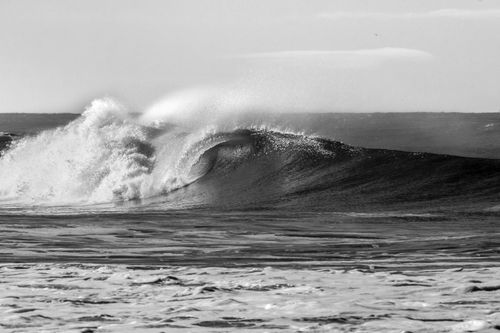 Free Powerful black and white wave crashing, capturing the essence of the sea's dynamic energy. Stock Photo