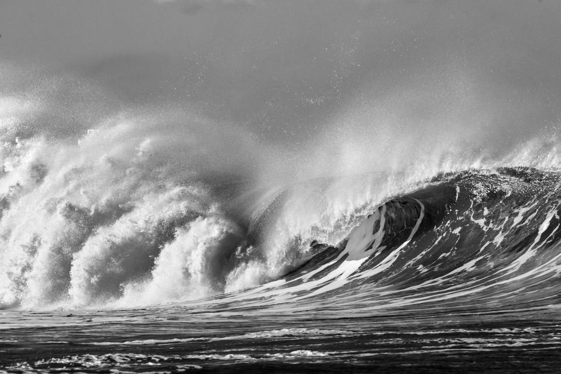 A Grayscale Photo of Big Ocean Waves · Free Stock Photo