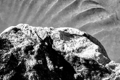 Grayscale Photo of Rock Formation