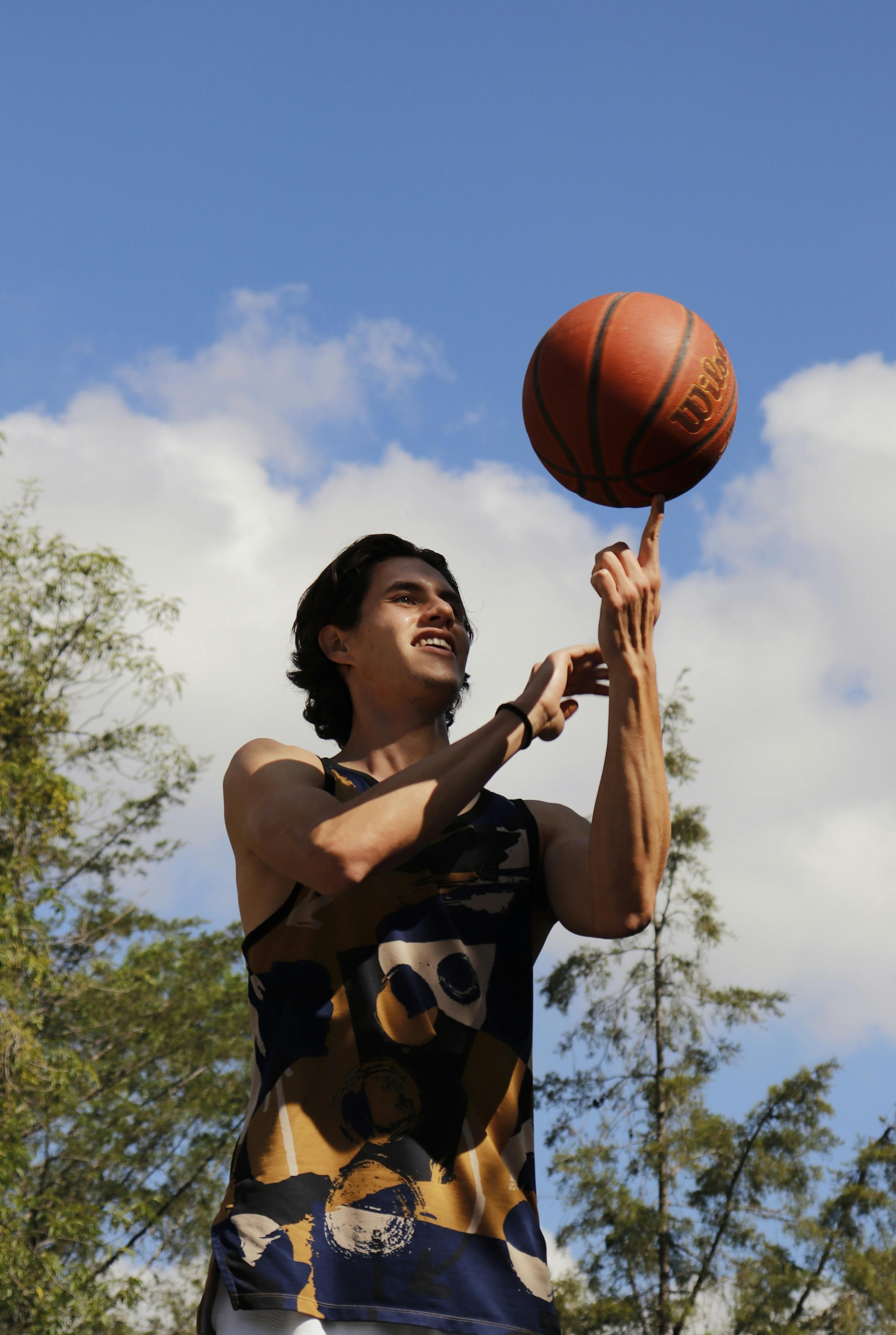 Spin a basketball on your finger.  Basketball pictures poses, Basketball  pictures, Sport portraits