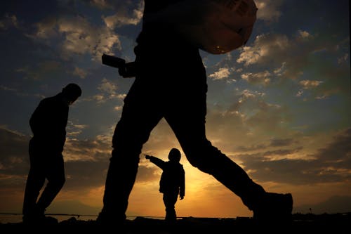 Silhouettes of People at Sunset