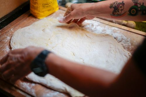 Free Close-up of hands kneading dough on a floured surface, perfect for baking themes. Stock Photo