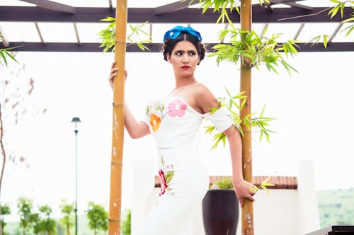 Free Woman Standing Between Bamboos Stock Photo