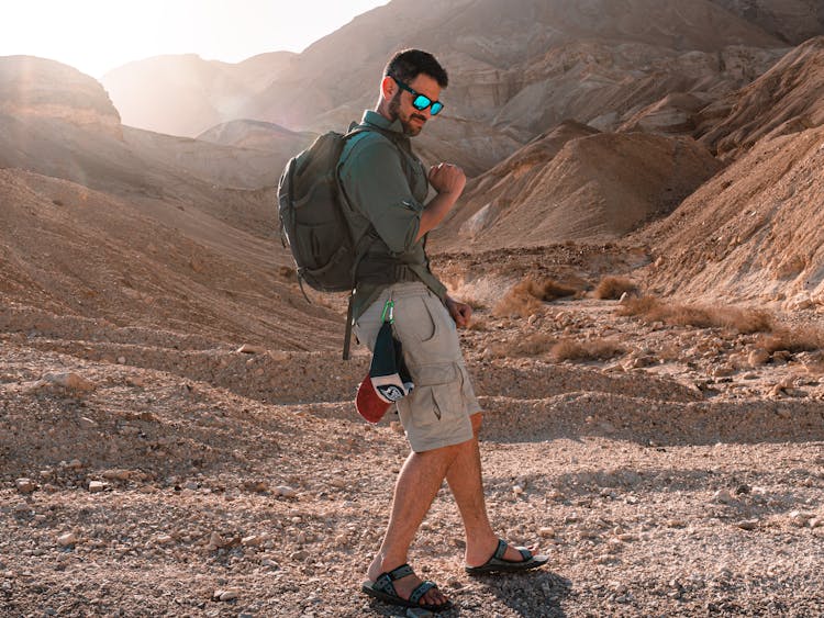 Man Hiking On Desert